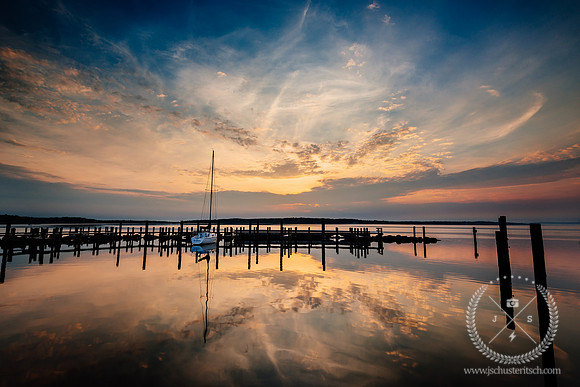 Lonely Sailboat at Sunrise